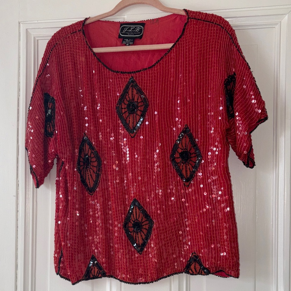 Elegant Red Sequin Blouse with Black Accents